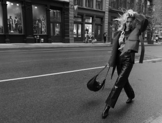 Main article image: image of a female model walking in the street wearing rag and bone clothes