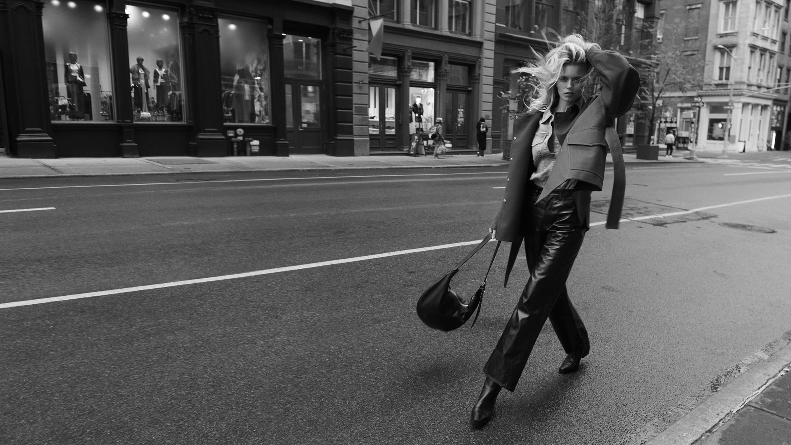 Main article image: image of a female model walking in the street wearing rag and bone clothes