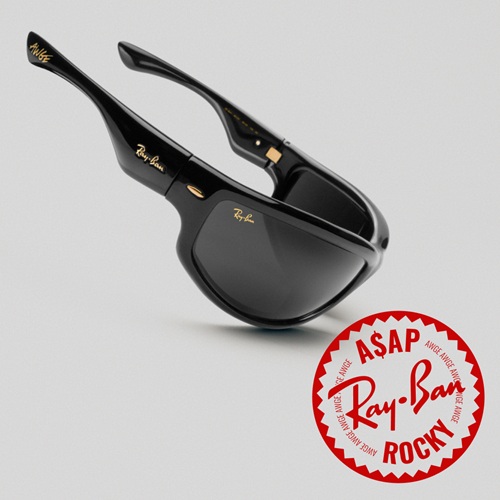 Lunettes de soleil de la collaboration Ray-Ban x A$APRocky avec des montures noires épaisses et des verres foncés, arborant le logo circulaire rouge A$APRocky