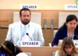 Image shows a World Health Assembly meeting room with two speakers at podiums - a man in a white suit and glasses on the left, and a woman in a navy blue blazer on the right. The setting is from the 78th World Health Assembly where the resolution on sensory impairments was being discussed.