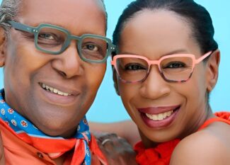 Image of a man and woman wearing OGI eyewear and hugging