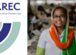 Q.REC logo (Quality of Refractive Error Care) featuring circular design elements in purple, navy, and mint green, alongside a smiling woman wearing glasses and a colourful orange and green headscarf.