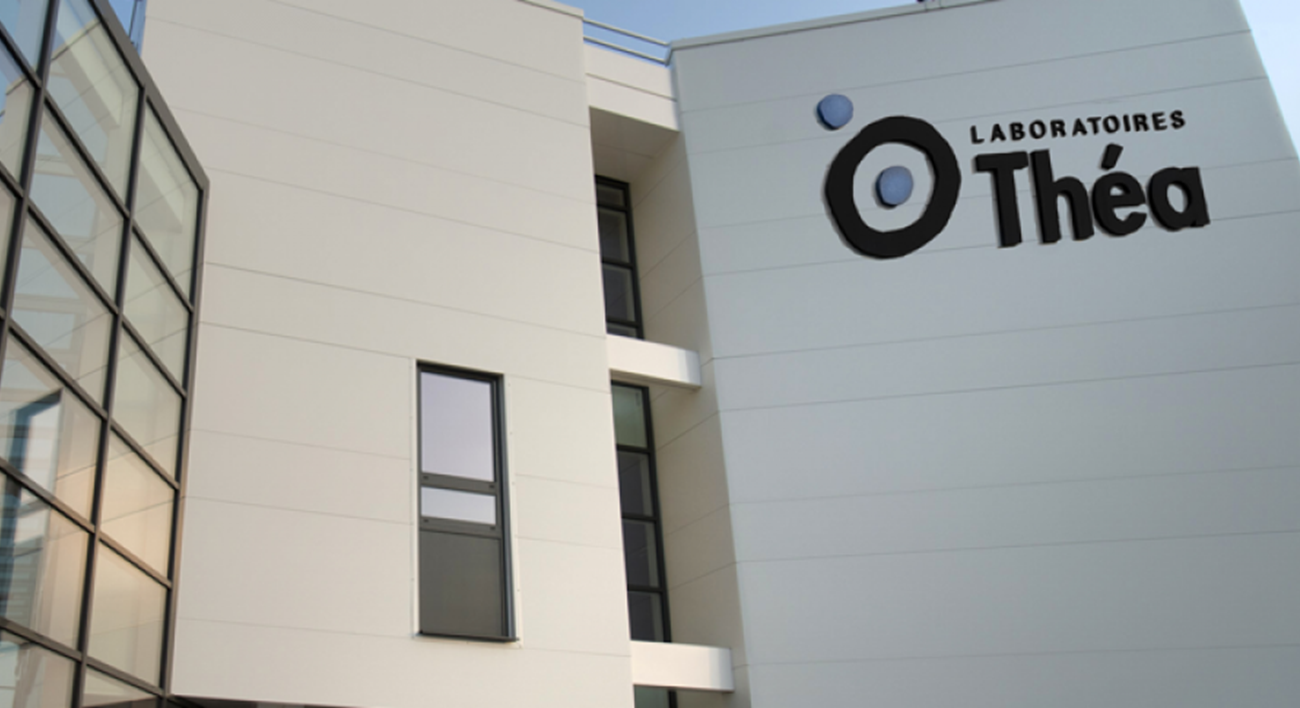 Building with Logo Laboratoires Thea on it