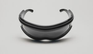Ray-Ban Ultra Wrap sunglasses shown from the front displaying their mask-like silhouette with wide curved lenses and sleek black frames against a white background