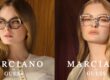 Deux photos promotionnelles côte à côte de deux femmes blondes différentes portant des lunettes Marciano by Guess. À gauche, une femme porte des lunettes œil-de-chat noires avec des ornements en cristal sur un fond de panneaux de bois chaleureux. À droite, une autre femme porte des montures rectangulaires à motif écaille de tortue avec un arrière-plan boisé similaire. Les deux images présentent le logo "MARCIANO by GUESS" en texte blanc en bas.