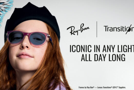 A young woman with long reddish-brown hair wearing a black beret and purple-framed Ray-Ban sunglasses with Transitions lenses. She's looking directly at the camera with a slight smile. The image includes the Ray-Ban and Transitions logos with text reading 'ICONIC IN ANY LIGHT, ALL DAY LONG' and 'Frames by Ray-Ban® — Lenses Transitions® GEN S™ Sapphire.