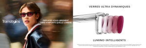 Image de campagne marketing Transitions Optical montrant une femme confiante portant des lunettes de soleil foncées et un blazer marine marchant dans un environnement urbain flou. Le texte indique 'MOVE FREELY IN ANY LIGHT' avec le logo Transitions. Le côté droit affiche 'ULTRA DYNAMIC' et 'LIGHT INTELLIGENT LENSES' avec une démonstration visuelle de la technologie des verres montrant cinq teintes progressives de verres allant du transparent au violet/magenta profond.