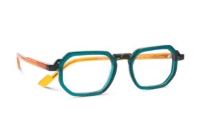 Face à Face FLICKER eyeglasses with bold geometric frames in teal and orange acetate, featuring sharp angles and layered transparent colors for a retro-futuristic look.