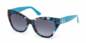 GUESS cat-eye sunglasses with multicoloured patterned front, turquoise temples, and gold G logo