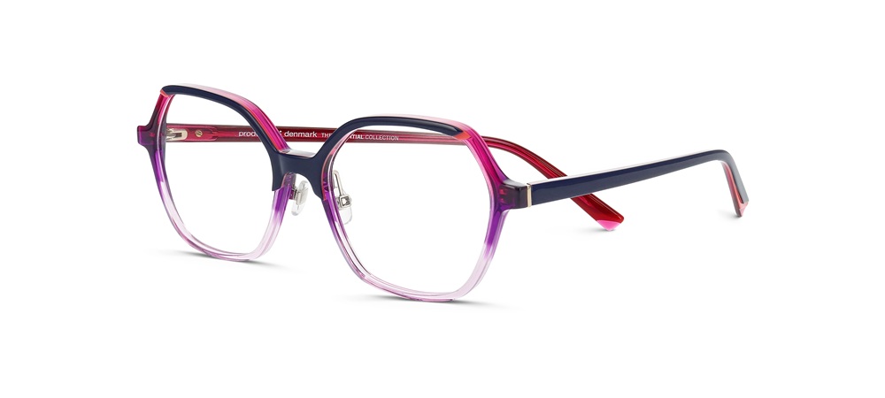 Product photography of Prodesign Denmark SPARKLE eyeglasses displaying a bold gradient acetate frame that transitions from deep purple at the top to clear pink at the bottom, with matching purple and red temple details. The oversized round-square silhouette demonstrates the brand's sculptural precision and multi-layered acetate craftsmanship.