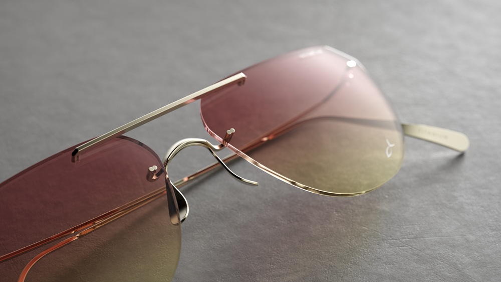 Gros plan détaillé des lunettes de soleil Blackfin Aero Loop Infinity aviateur mettant en valeur le design sans monture breveté avec pont en titane fluide, verres dégradés rose-ambre, et composants en titane sculptés avec précision et finition polie