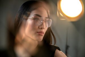 Portrait of a woman wearing Blackfin Aero Loop Infinity optical glasses with aviator-inspired shape, featuring the ultra-lightweight titanium construction and feminine soft lines characteristic of the Silmo d'Or 2025 finalist collection