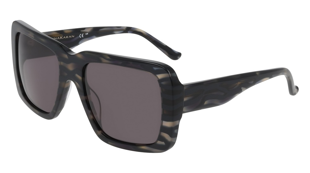 Donna Karan oversized square sunglasses in dark tortoiseshell pattern with grey lenses, shown in three-quarter view against a white background