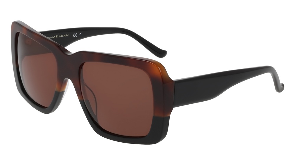 Donna Karan oversized square sunglasses in brown tortoiseshell and black colourway with gradient brown lenses, displayed against a white background