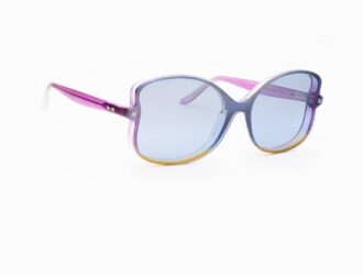 Three-quarter view of SNOB Milano Butterfly glasses highlighting the vibrant fuchsia, blue and yellow color blend