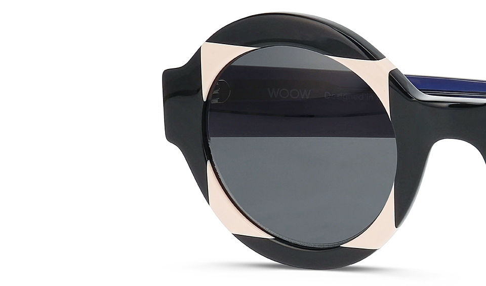 Detail shot of WOOW SUPER TACTIC sunglasses displaying bold geometric design with black and nude color blocking and dark lenses