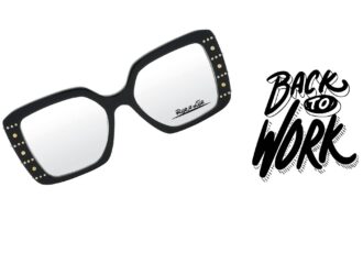 Black rectangular eyeglasses with gold studded details on the temples, featuring the "Back to Work" campaign branding French: Lunettes rectangulaires noires avec détails dorés cloutés sur les branches, présentant la campagne "Back to Work"