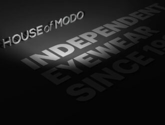 Three-dimensional House of Modo logo with the words Independence, Eyewear, Design and Storytelling on black background