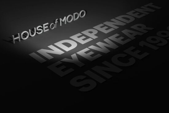 Three-dimensional House of Modo logo with the words Independence, Eyewear, Design and Storytelling on black background