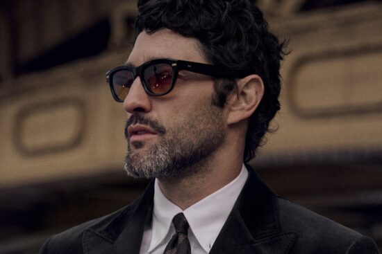 Man wearing Brunello Cucinelli black acetate sunglasses with formal attire
