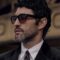 Man wearing Brunello Cucinelli black acetate sunglasses with formal attire