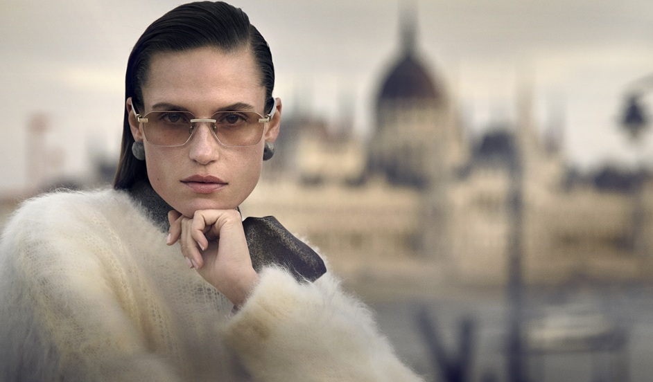 Woman wearing Brunello Cucinelli frameless optical glasses with gold accents