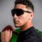 Patrick Mahomes wearing Oakley Sutro Lite Sweep sunglasses while holding a football