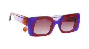 FACE A FACE Flare sunglasses with horizontal lens cut in purple and red translucent acetate with orange temple tips, showcasing the sunset-inspired design