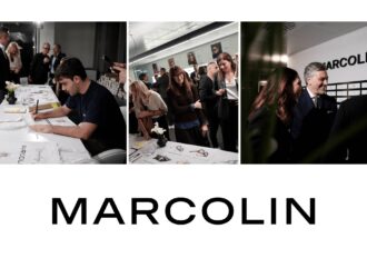 Image 1: "Événement d'inauguration du showroom Marcolin à Barcelone avec invités découvrant les illustrations de l'artiste