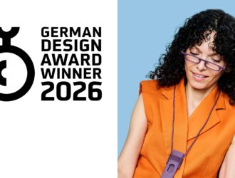 German Design Award Winner 2026 badge with woman wearing read on light glasses