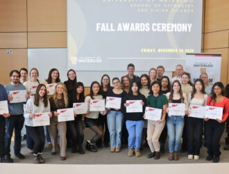 Award recipients and faculty pose with certificates at the University of Waterloo School of Optometry Fall Awards Ceremony