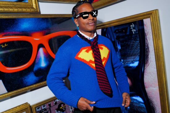 ASAP wearing Ray-Ban sunglasses posed among framed eyewear photography at the Clubhouse installation