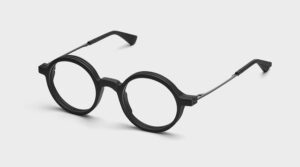 NIRVAN JAVAN ZURICH collection black round eyeglasses with 3D-printed PA12 frame and metal temples on light background