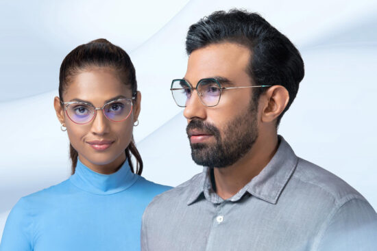 Woman and man wearing modern ZEISS progressive eyeglasses with blue light filtering lenses against a clean white background