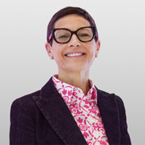 Blurred headshot of a woman in a dark blazer and patterned pink shirt, representing the 2026 Polaris Award honouree.