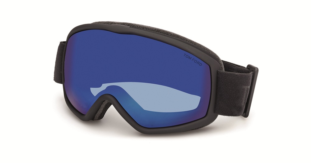 Side-angled view of the TOM FORD FT1321 winter goggle, highlighting the black elastic strap and the high-tech mirrored blue spherical lens.