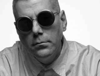 PRESS Eyewear Carved Collection round sunglasses modeled in black and white portrait