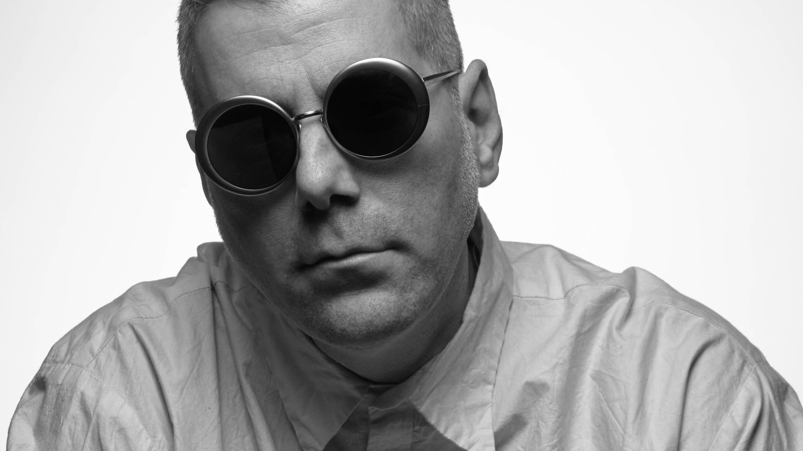 PRESS Eyewear Carved Collection round sunglasses modeled in black and white portrait