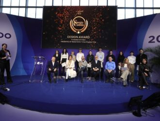 The 2026 Sergio Cereda Eyewear Design Award finalists and winners posing with the international judging panel at the MIDO Milano Eyewear Show.