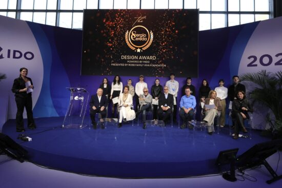 The 2026 Sergio Cereda Eyewear Design Award finalists and winners posing with the international judging panel at the MIDO Milano Eyewear Show.