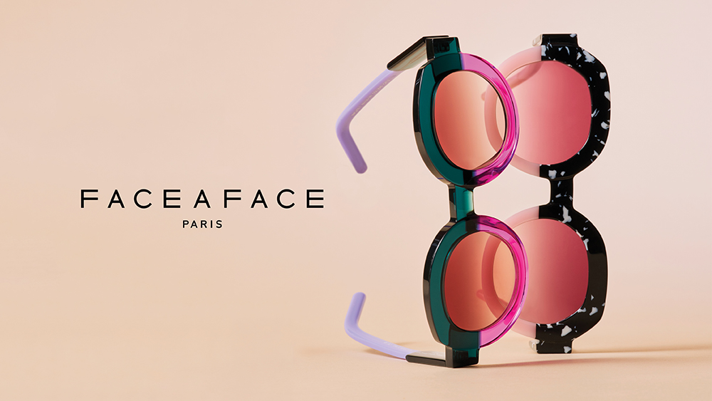 A vertical display of two round, bold-colored sunglasses—one in teal and magenta, the other in pink and black marble—beside the Face à Face Paris logo.