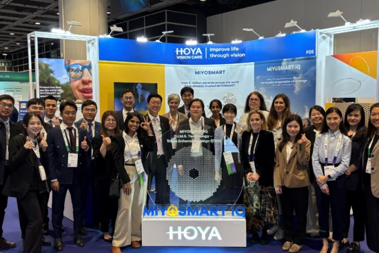 A large group of HOYA Vision Care representatives standing together at the MiYOSMART iQ launch event at the Asia-Pacific Academy of Ophthalmology Congress in Hong Kong.