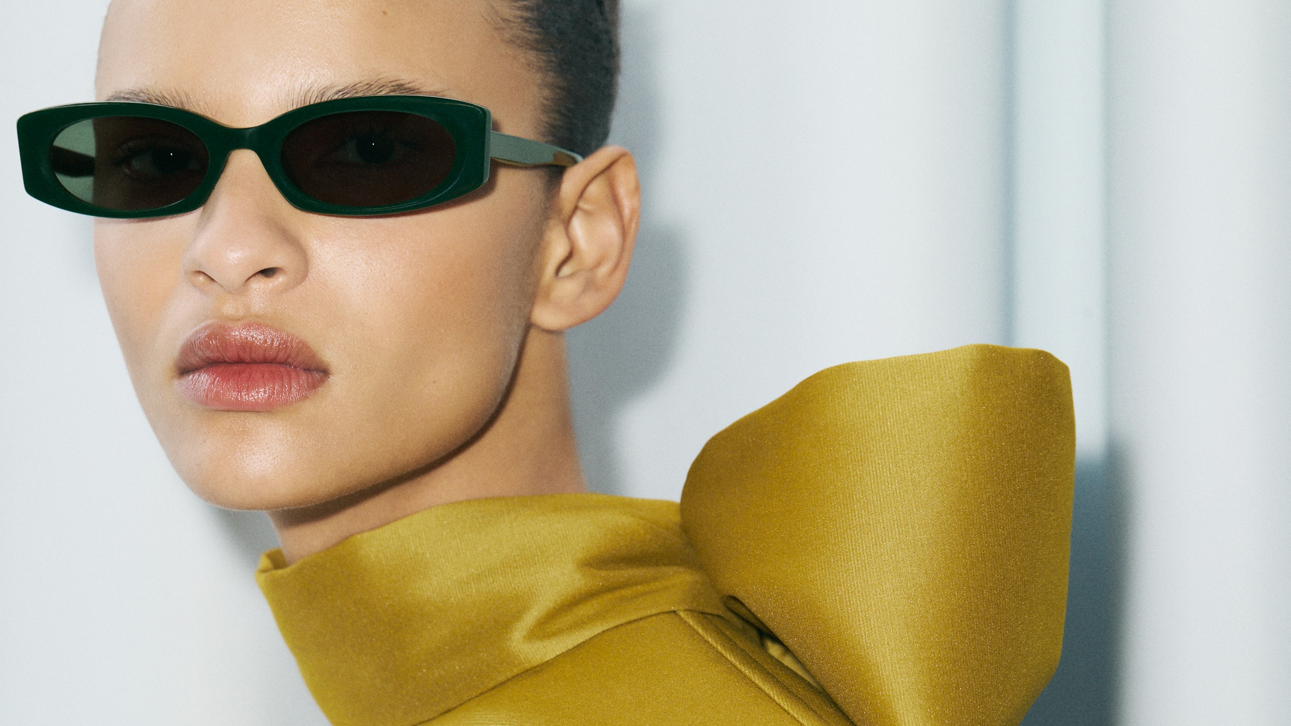 Model wearing MELIA sunglasses in forest green — GIGI STUDIOS Portrait Series campaign