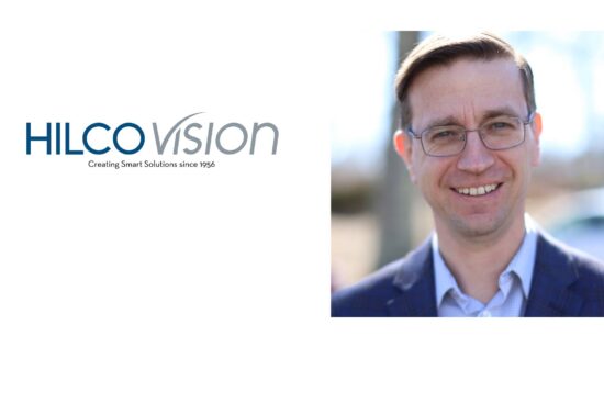 Hilco Vision logo alongside a portrait of John Lakey