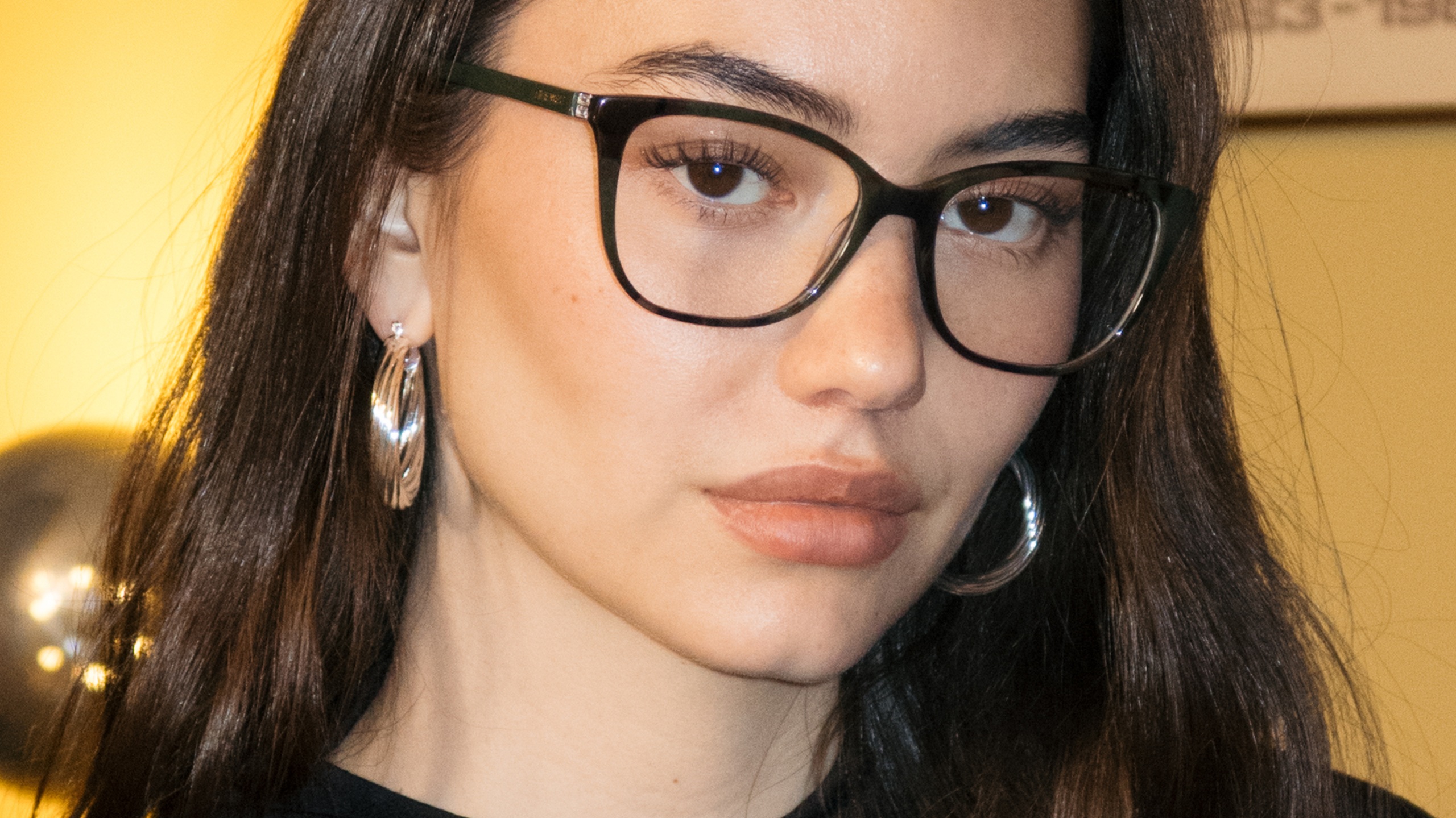 Woman wearing black rectangular eyeglasses
