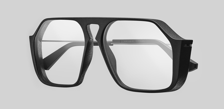 Monture aviateur noire imprimée en 3D avec branches en titane sur fond gris