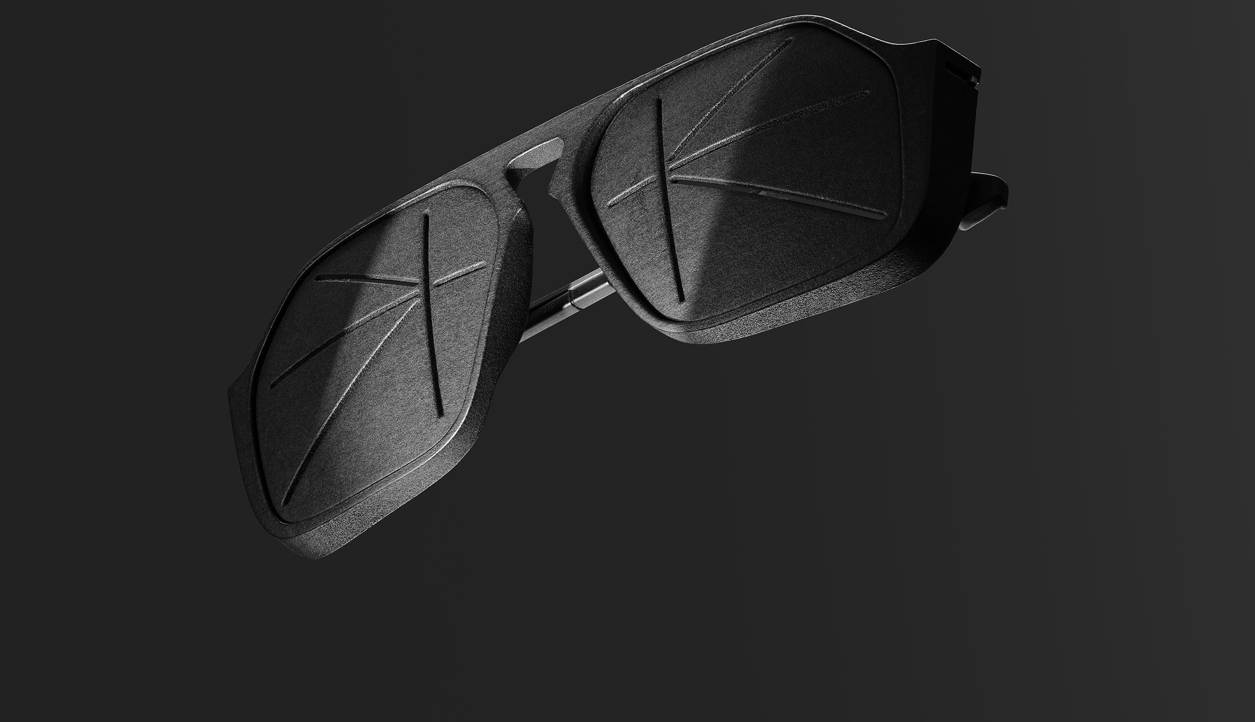 Zurich Collection sunglasses with geometric Inuit lenses on a dark background