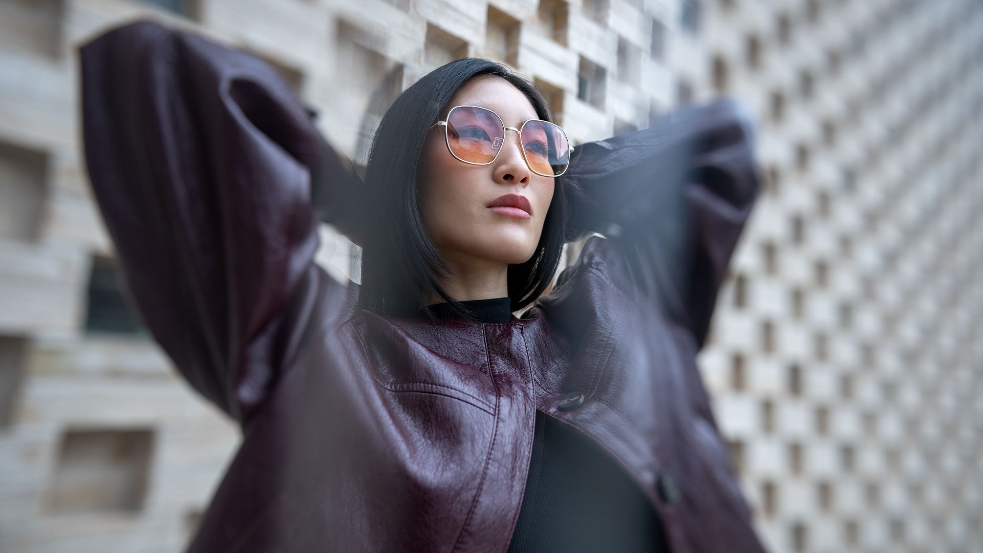 Woman wearing Blackfin oversized geometric sunglasses with warm gradient lenses