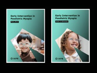Two side-by-side document covers on a dark background, both titled "Early Intervention in Paediatric Myopia" and published by IAPB. The left cover is labelled "Policy Brief" and features a smiling young boy wearing blue glasses giving a thumbs up. The right cover is labelled "Guide to Advocacy" and features a smiling young girl wearing glasses against a teal geometric background.