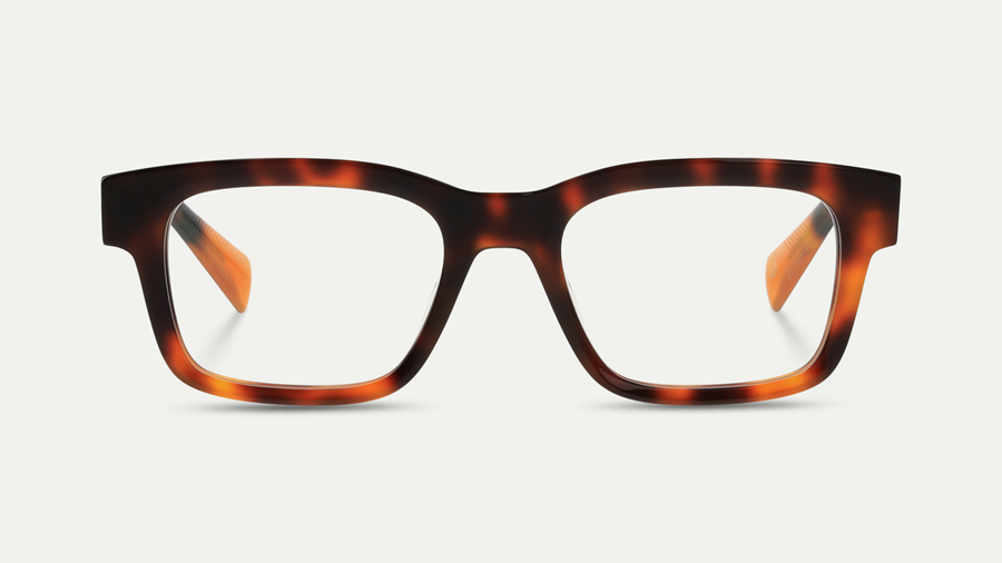 Vue de face d'une monture de lunettes carrée et épaisse en acétate écaille de tortue avec des branches intérieures ambre/orange chaud, sur fond neutre clair.
